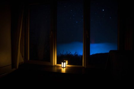 depositphotos_264809236-stock-photo-night-scene-stars-seen-window
